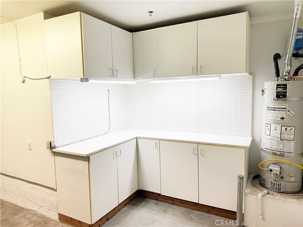 9 Lilac Irvine, CA 92618 - Photo 32 of 49 a utility room with cabinets washer and dryer