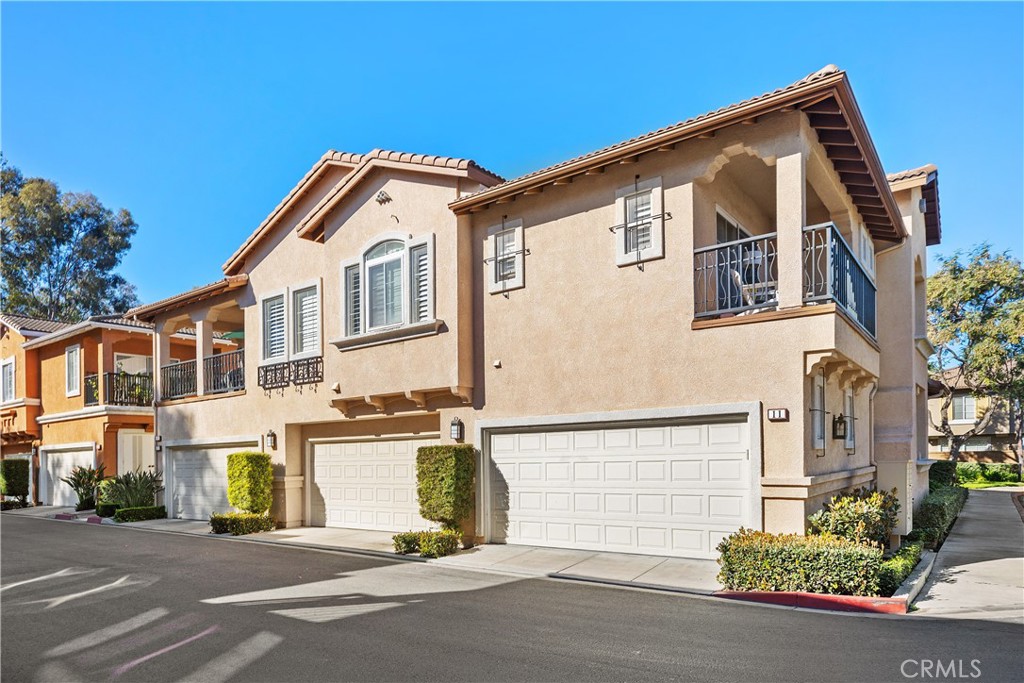 9 Lilac Irvine, CA 92618 - Photo 35 of 49 a front view of a house with a road