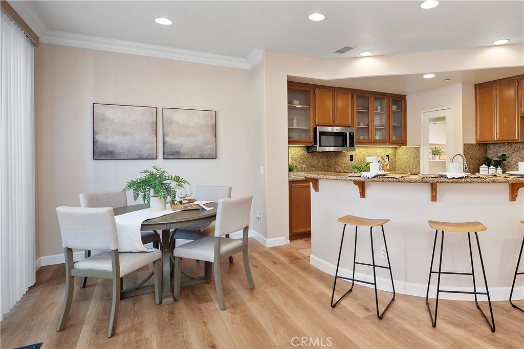 9 Lilac Irvine, CA 92618 - Photo 4 of 49 a view of a dining room with furniture and wooden floor