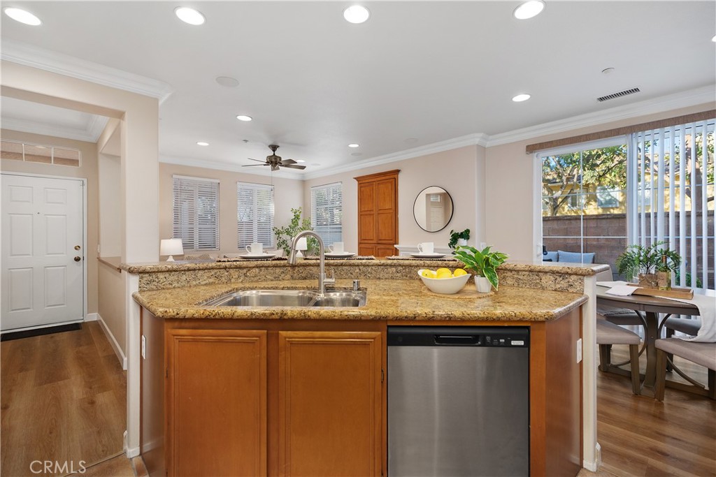 9 Lilac Irvine, CA 92618 - Photo 8 of 49 a kitchen with stainless steel appliances granite countertop a stove a sink and a dining table