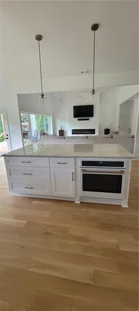 a kitchen with stainless steel appliances a stove sink and refrigerator