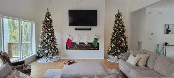 a kitchen with stainless steel appliances granite countertop a refrigerator a sink and a stove