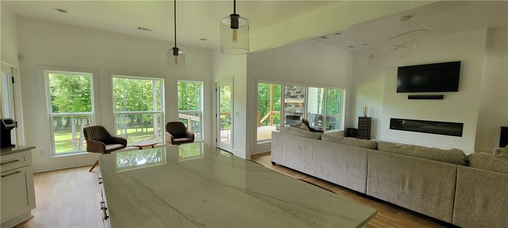 8 Ripplewood Trail Euharlee, GA 30145 - Photo 25 of 90 a living room with furniture and a flat screen tv