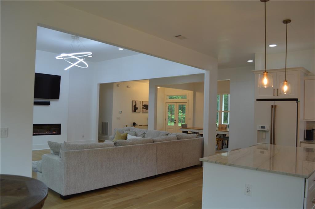 8 Ripplewood Trail Euharlee, GA 30145 - Photo 39 of 90 a living room with furniture and a flat screen tv