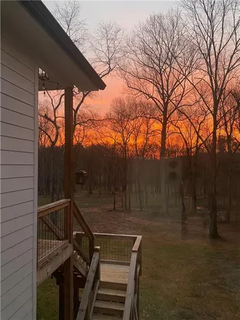a room with pool table and a wooden floor