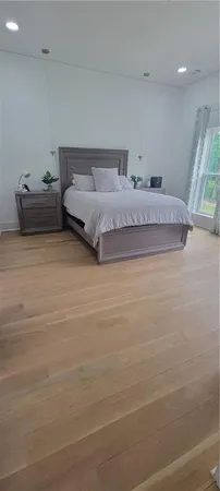 a big yard with trees in the background