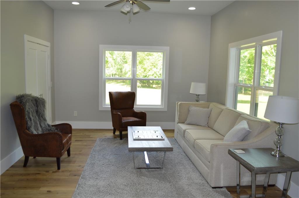 8 Ripplewood Trail Euharlee, GA 30145 - Photo 59 of 90 a living room with furniture and a large window