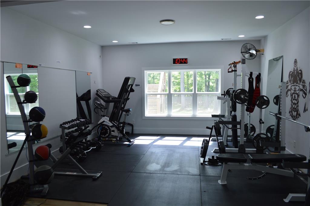 8 Ripplewood Trail Euharlee, GA 30145 - Photo 75 of 90 a view of a room with gym equipment