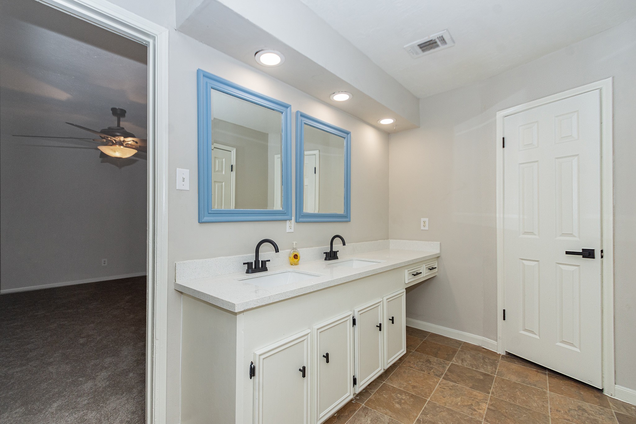 29019 Stapleford Street Spring, TX 77386 - Photo 22 of 29 a bathroom with a double vanity sink and mirror