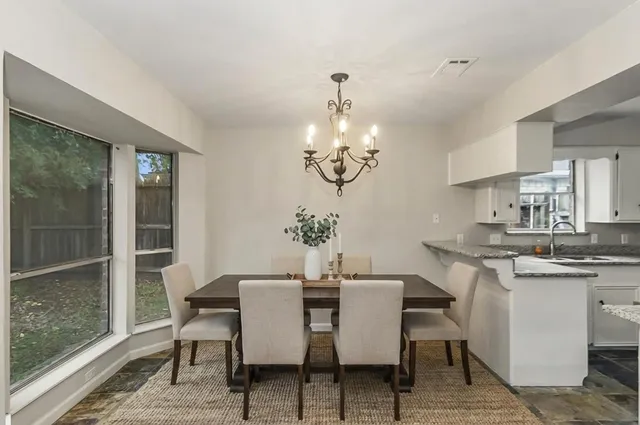 a view of empty room with wooden floor and fireplace