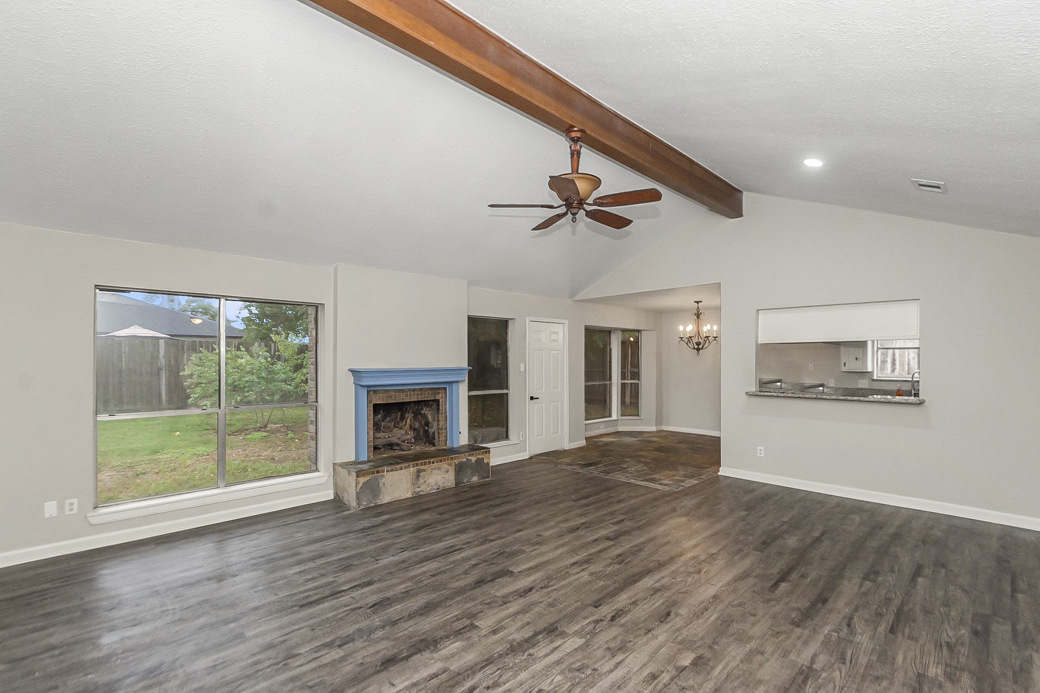 29019 Stapleford Street Spring, TX 77386 - Photo 7 of 29 a view of empty room with wooden floor and fireplace
