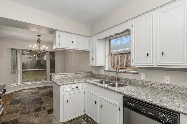 a kitchen with a sink and a refrigerator