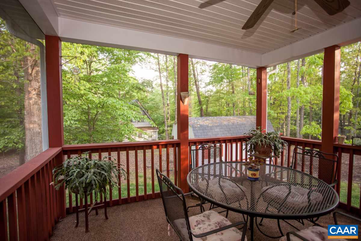 46 Riverside Drive Palmyra, VA 22963 - Photo 2 of 19 a view of a two chairs in the deck