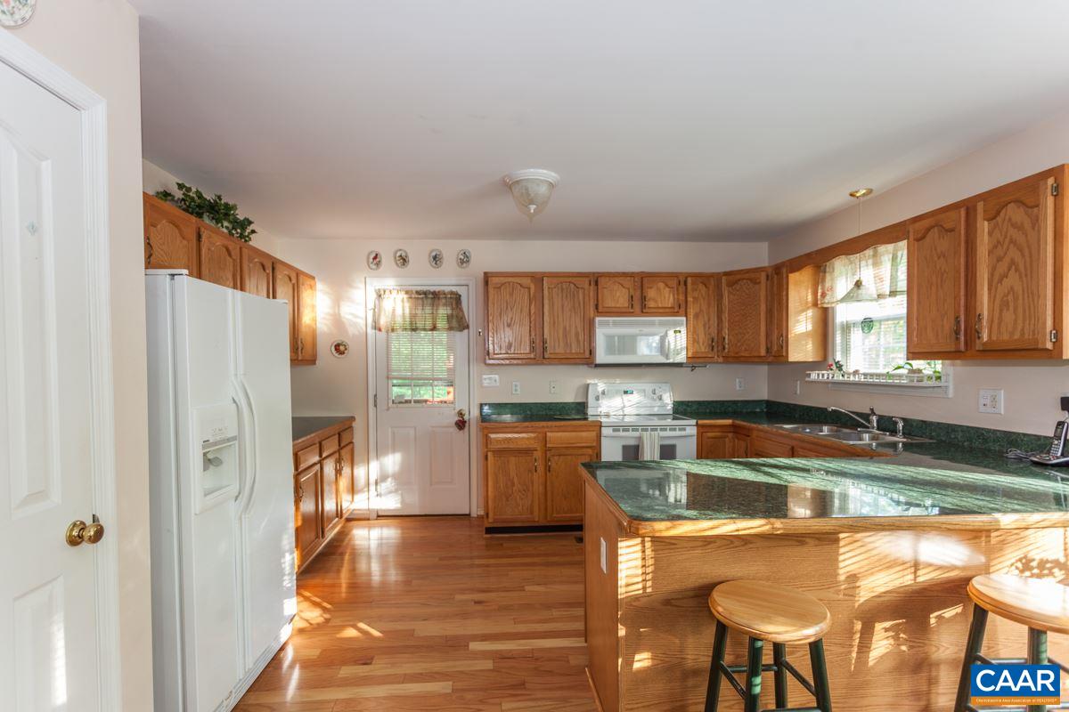 46 Riverside Drive Palmyra, VA 22963 - Photo 3 of 19 a kitchen with a refrigerator and a stove top oven