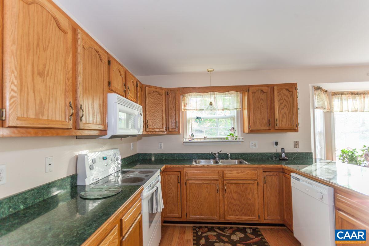 46 Riverside Drive Palmyra, VA 22963 - Photo 7 of 19 a kitchen with stainless steel appliances granite countertop a sink stove and cabinets