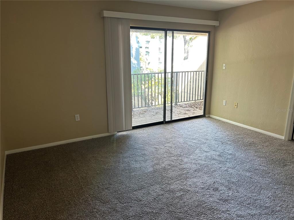 507 Northwest 39th Road, Unit 310 Gainesville, FL 32607 - Photo 17 of 18 a view of an empty room with a window