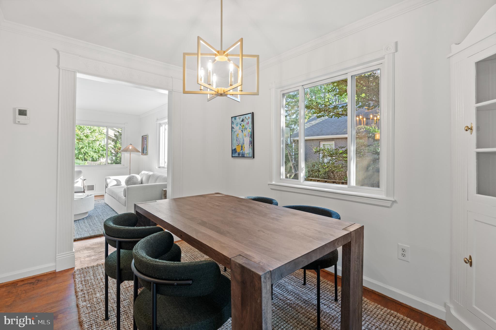 307 East Oxford Avenue, Unit 1/2 Alexandria, VA 22301 - Photo 11 of 34 a view of a dining room with furniture window and wooden floor
