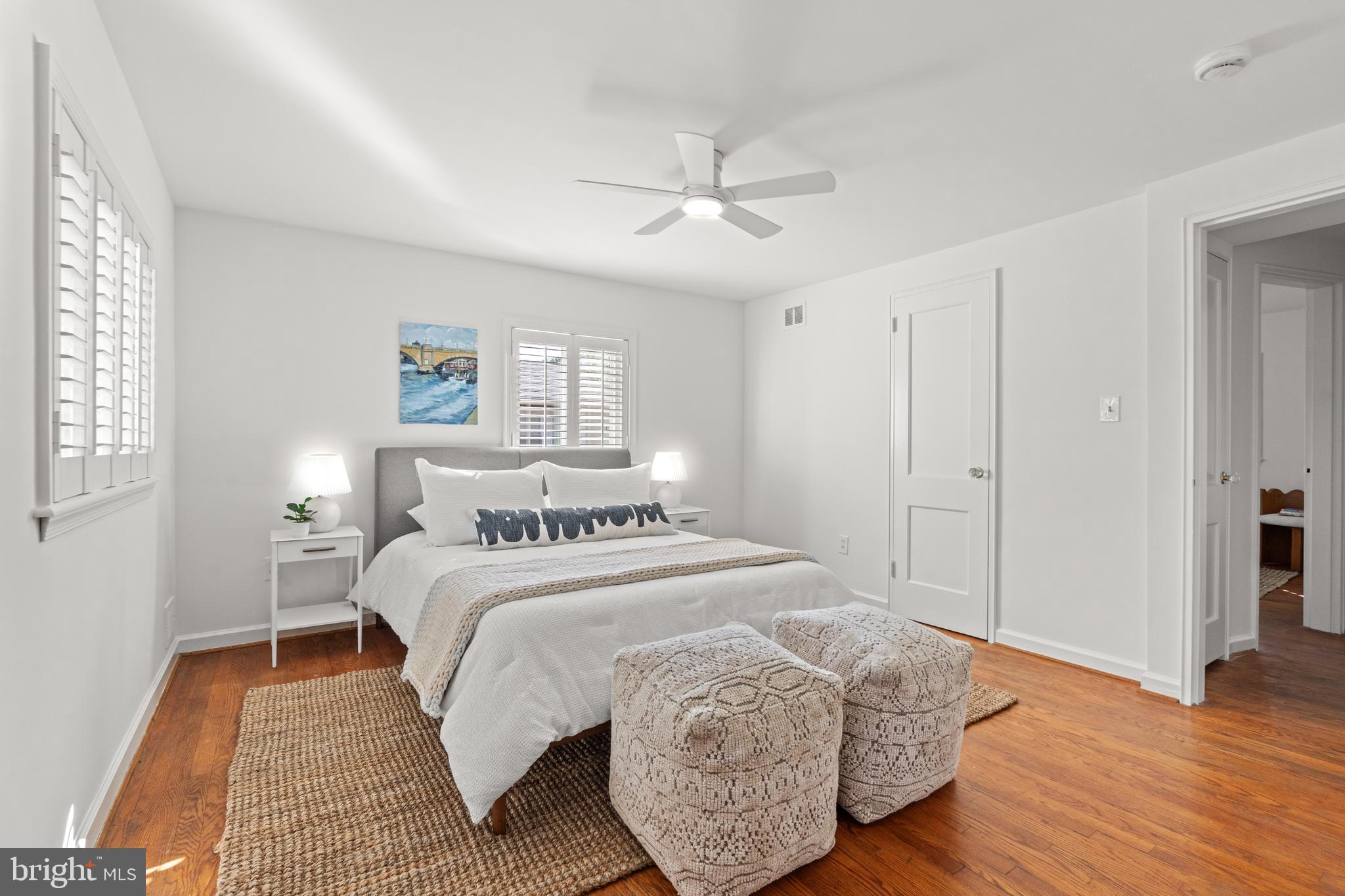 307 East Oxford Avenue, Unit 1/2 Alexandria, VA 22301 - Photo 20 of 34 a bedroom with a bed and wooden floor