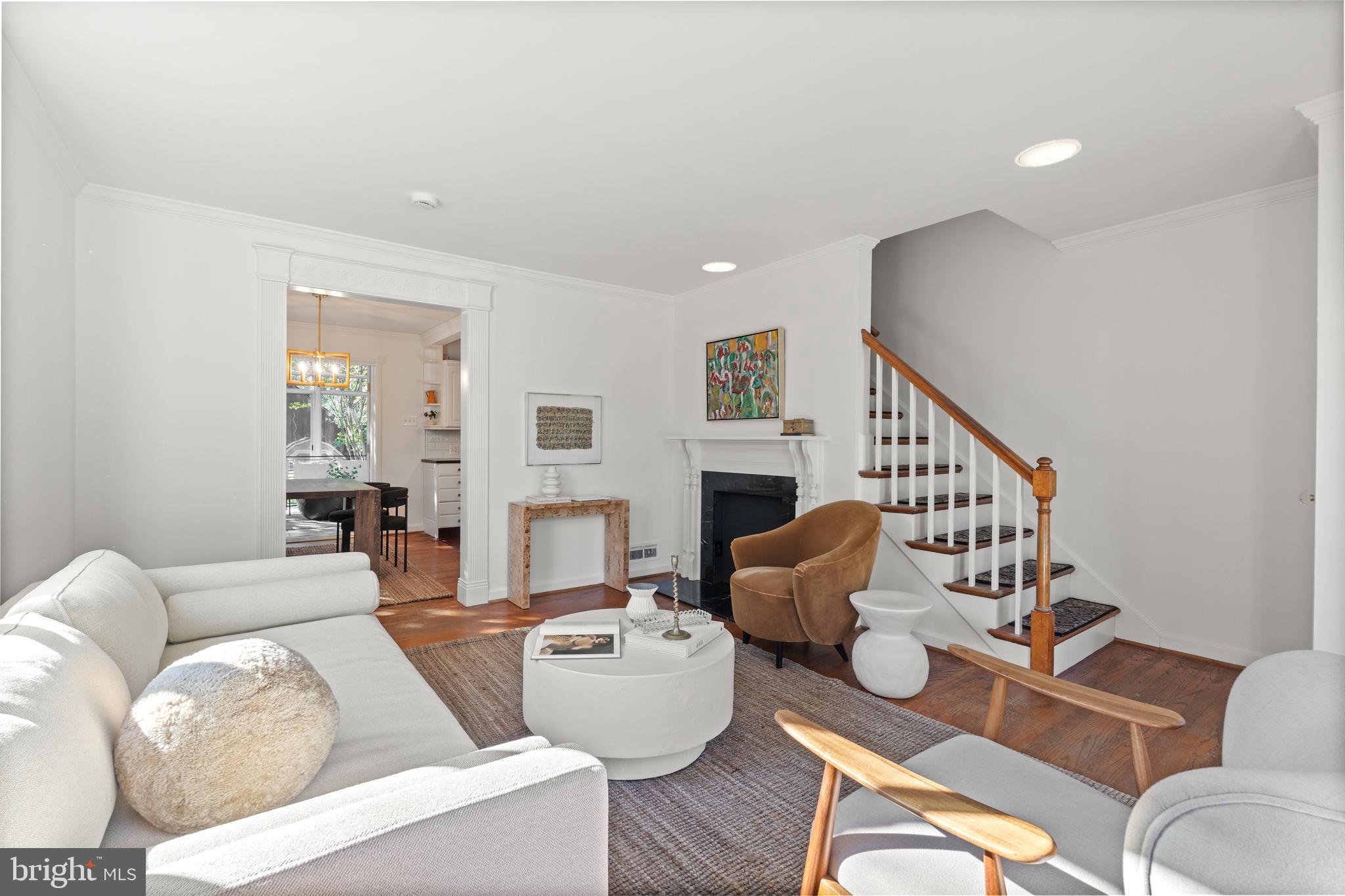 307 East Oxford Avenue, Unit 1/2 Alexandria, VA 22301 - Photo 2 of 34 a living room with fireplace furniture and a wooden floor