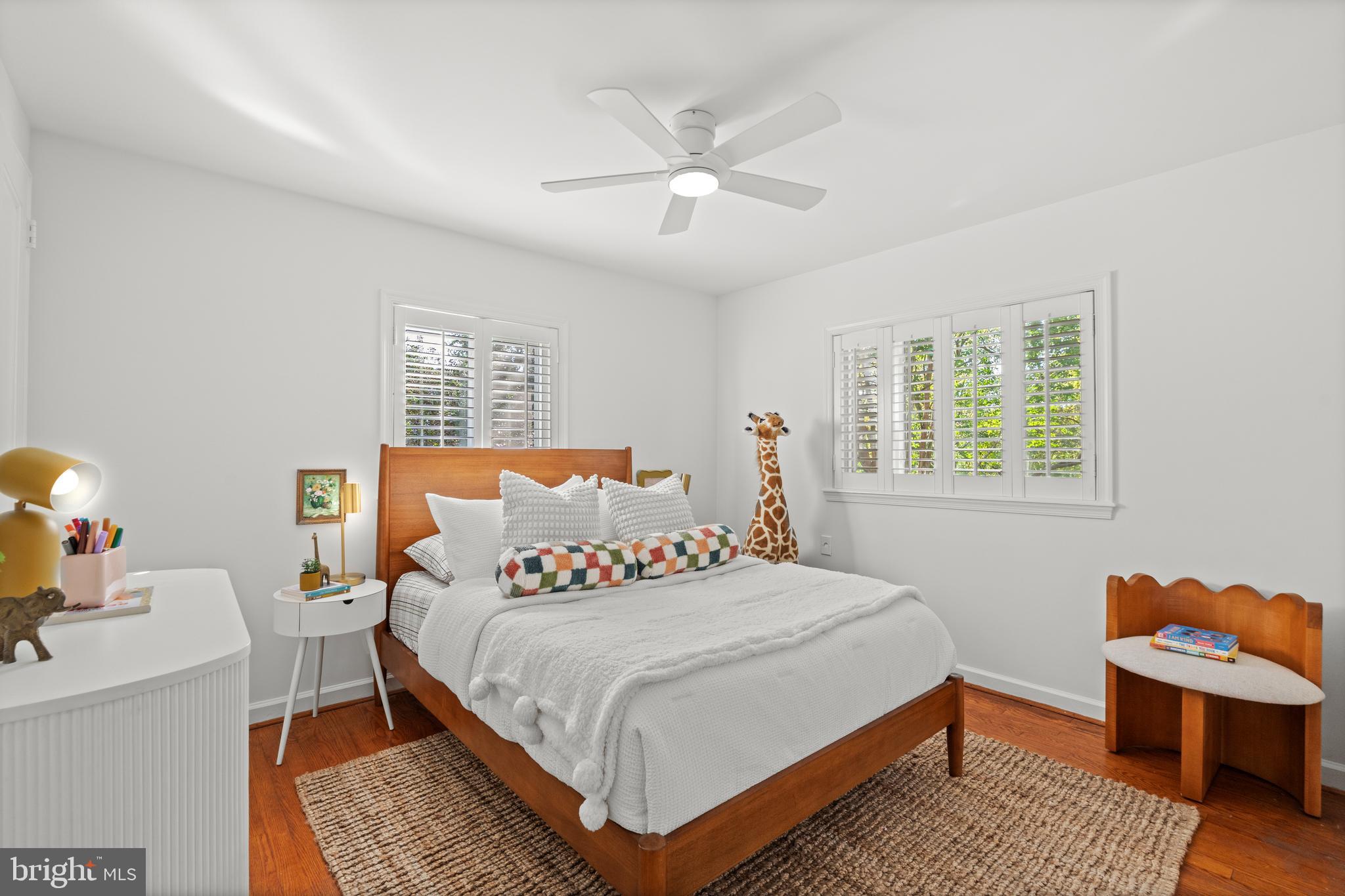307 East Oxford Avenue, Unit 1/2 Alexandria, VA 22301 - Photo 22 of 34 a bedroom with a bed wooden floor and window