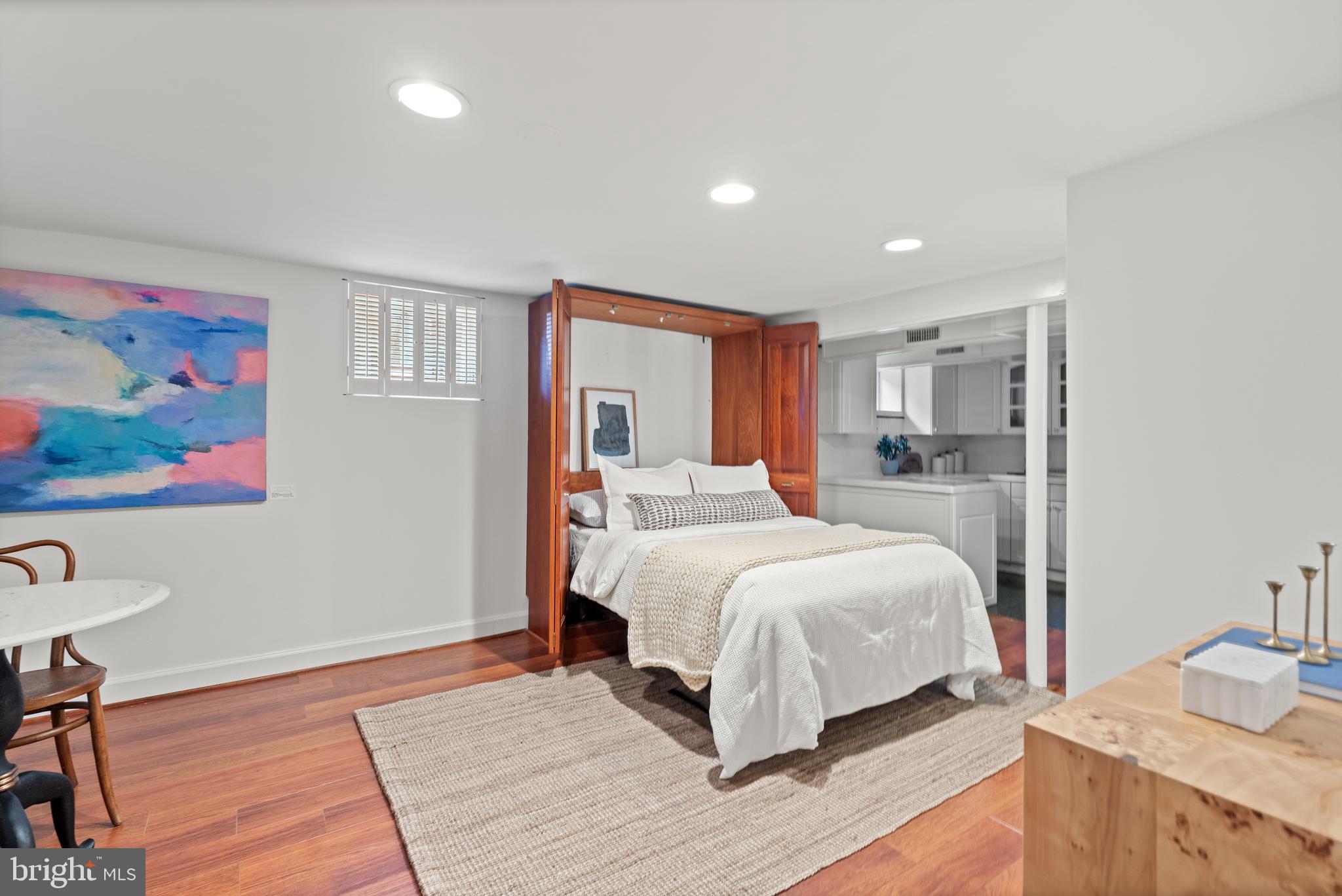 307 East Oxford Avenue, Unit 1/2 Alexandria, VA 22301 - Photo 23 of 34 a bedroom with a large bed and a wooden floor