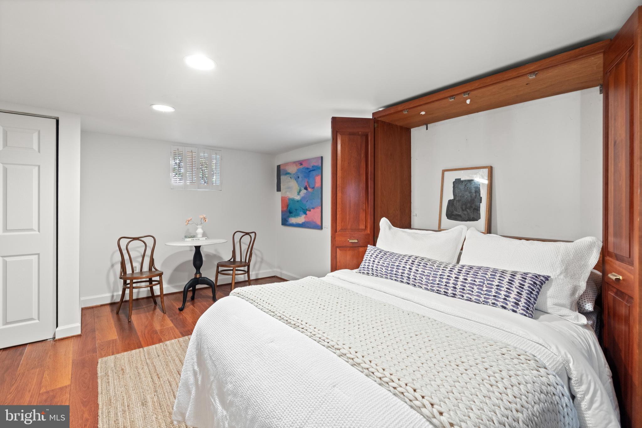307 East Oxford Avenue, Unit 1/2 Alexandria, VA 22301 - Photo 24 of 34 a bedroom with a bed and wooden floor