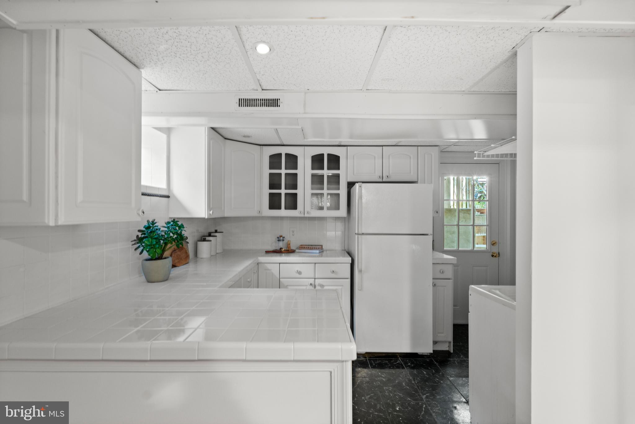 307 East Oxford Avenue, Unit 1/2 Alexandria, VA 22301 - Photo 25 of 34 a bathroom with a sink and a refrigerator