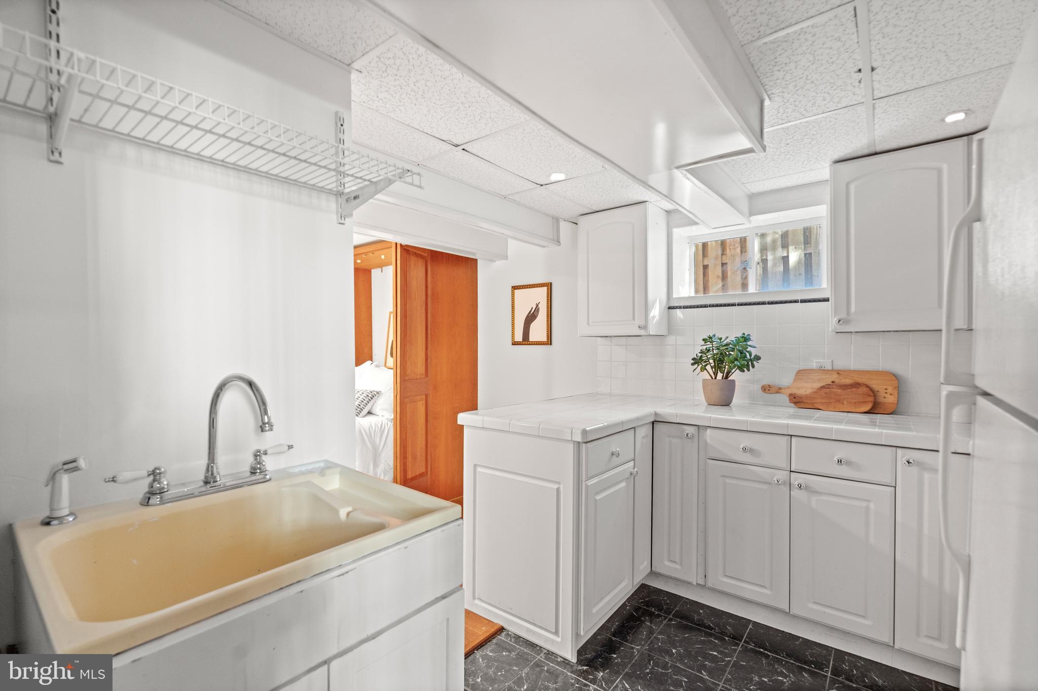 307 East Oxford Avenue, Unit 1/2 Alexandria, VA 22301 - Photo 26 of 34 a bathroom with a sink and a mirror