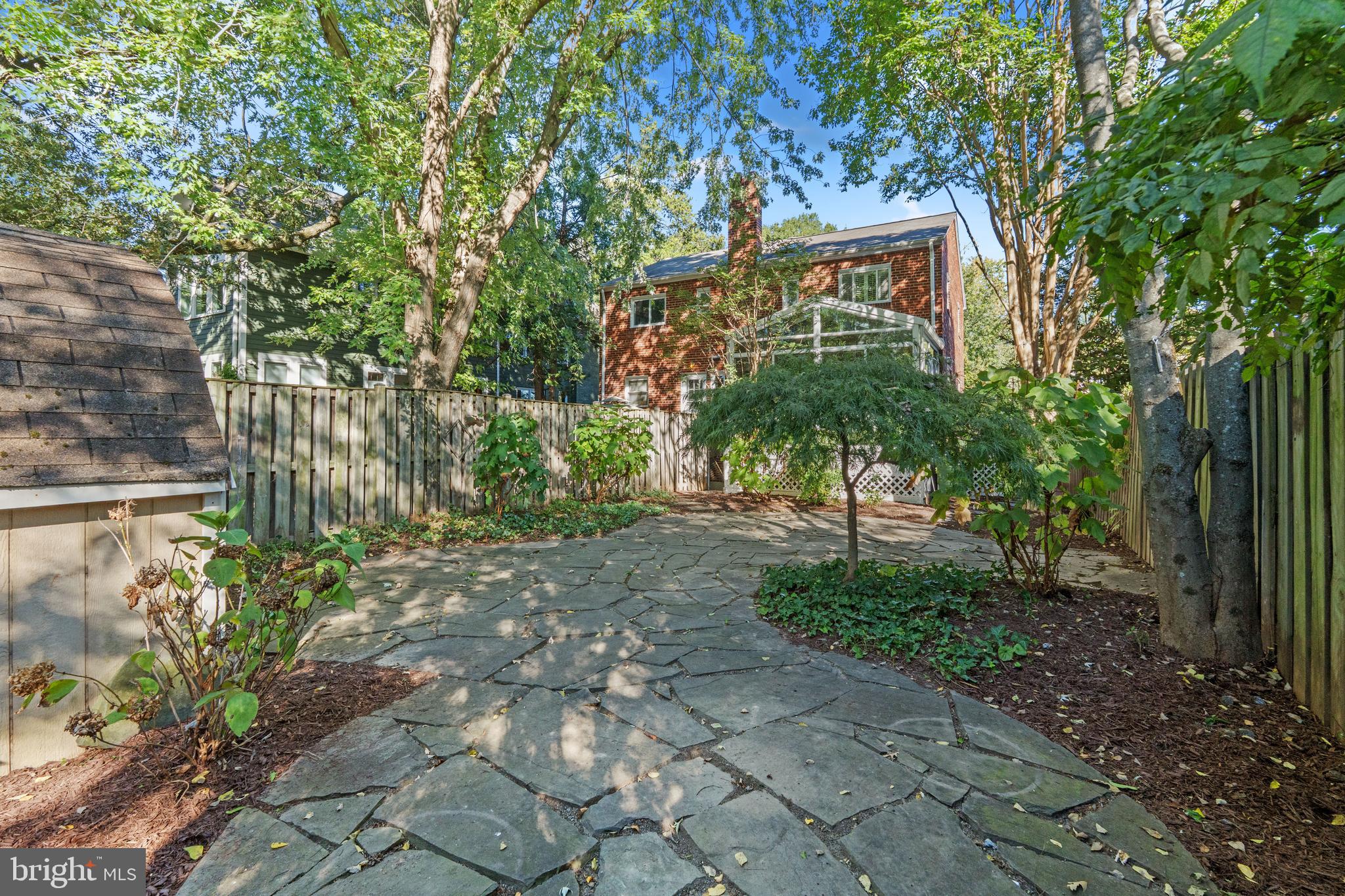 307 East Oxford Avenue, Unit 1/2 Alexandria, VA 22301 - Photo 31 of 34 a front view of a house with a tree