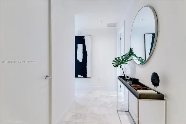 a room with mirror and window