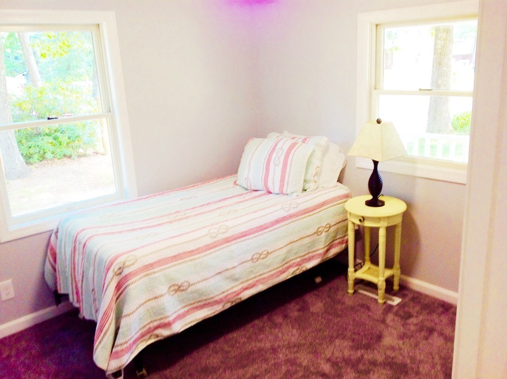 16 Cedar Road Groton, MA 01450 - Photo 12 of 25 a bedroom with a bed and a window