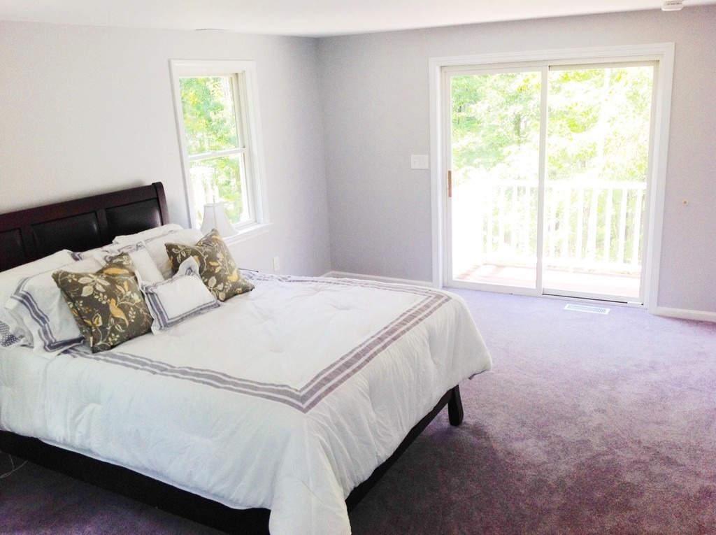 16 Cedar Road Groton, MA 01450 - Photo 15 of 25 a bedroom with a bed and a window
