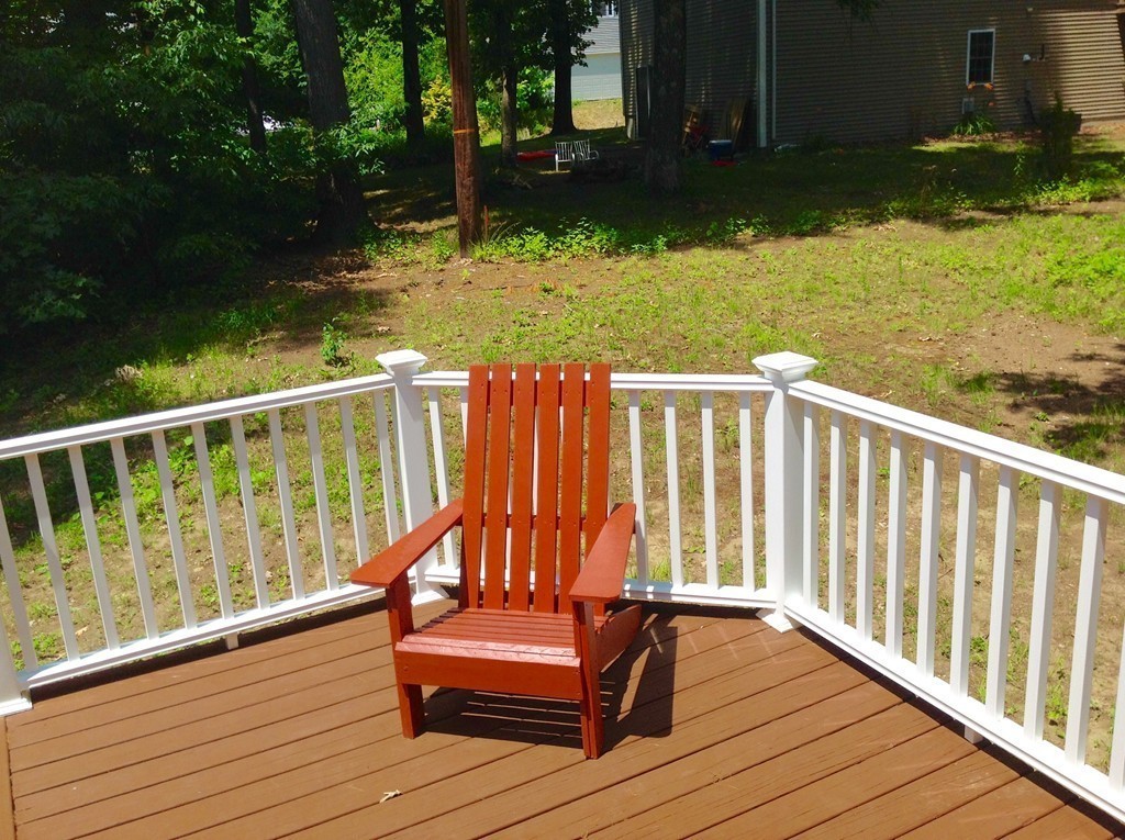 16 Cedar Road Groton, MA 01450 - Photo 24 of 25 a view of a wooden deck and a lake view