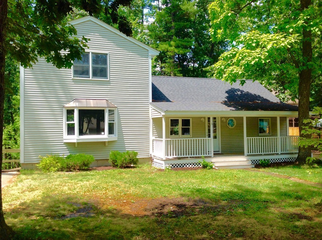 16 Cedar Road Groton, MA 01450 - Photo 3 of 25 a front view of a house with a yard