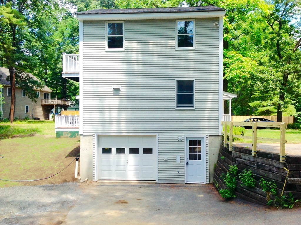 16 Cedar Road Groton, MA 01450 - Photo 4 of 25 a view of a house with backyard