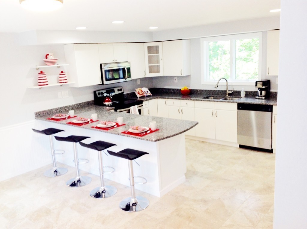 16 Cedar Road Groton, MA 01450 - Photo 6 of 25 a living room with granite countertop furniture and a dining table