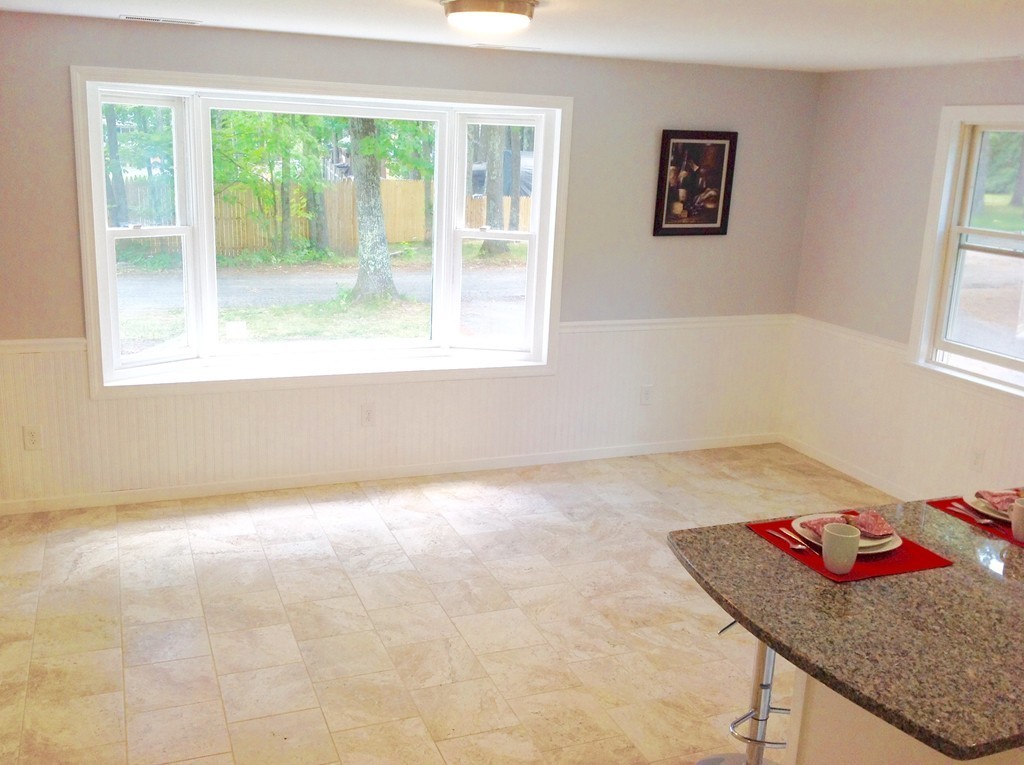 16 Cedar Road Groton, MA 01450 - Photo 7 of 25 a bathroom with a granite countertop sink and a window