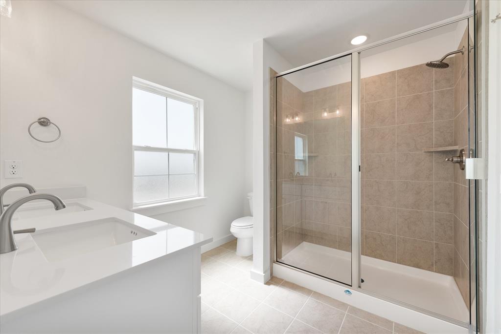 1215 Chestnut Court Runaway Bay, TX 76426 - Photo 21 of 28 a bathroom with a shower and a sink