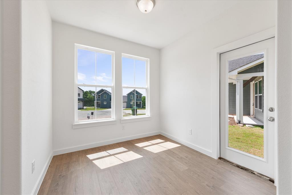 1215 Chestnut Court Runaway Bay, TX 76426 - Photo 9 of 28 a view of a room that has a bed and a window