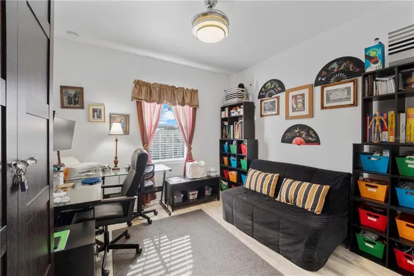 a reading room with furniture and a window