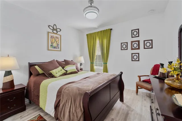 a bedroom with a bed and a table in it