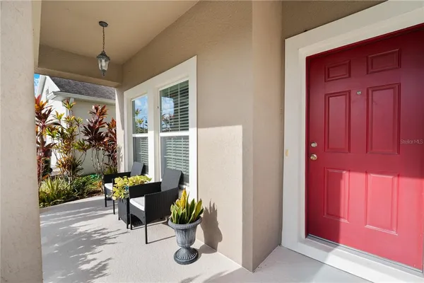 a dining room with furniture and a window