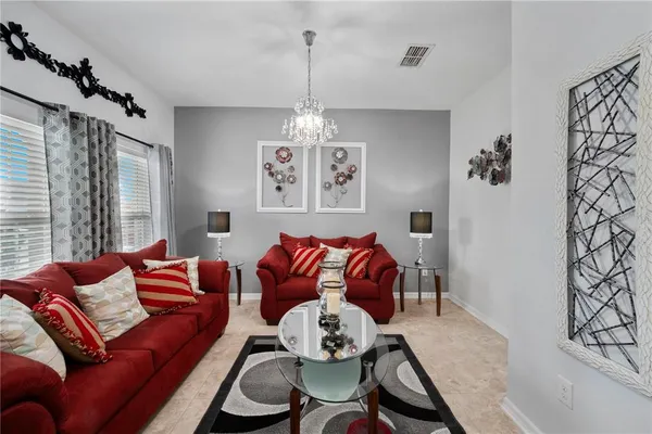 a living room with furniture and a window