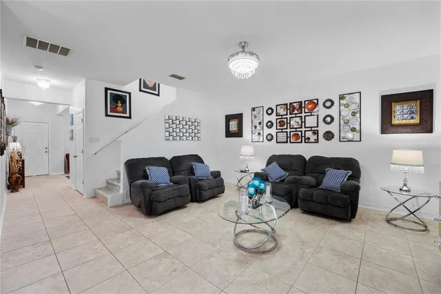 a living room with furniture and a table
