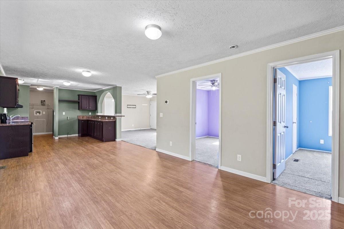138 Dayton Road Dallas, NC 28034 - Photo 5 of 26 a view of a kitchen with a sink and a refrigerator