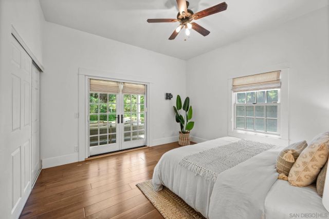 a spacious bedroom with a large bed and a window