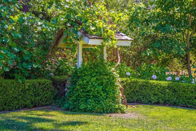 a porch with view of a backyard
