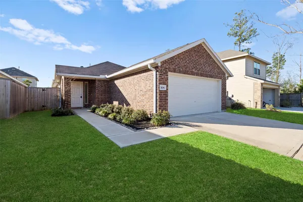 a view of a house with a back yard