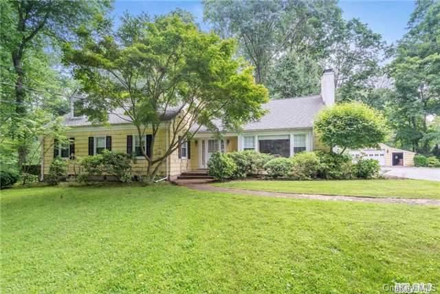 105 Linden Farms Road Locust Valley, NY 11560 - Photo 1 of 1 a front view of a house with garden