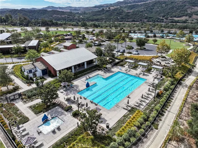 an aerial view of a swimming pool and outdoor space